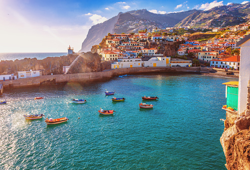 The beautiful fishing village of Camara de Lobos on the portugese Island of Madeira in warm evening sunshine light.